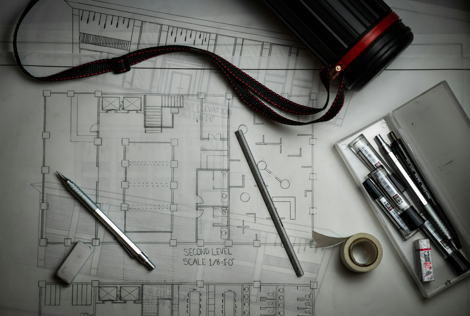 Architectural plans and drafting pencils